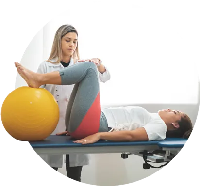 Physical therapist guiding her patient during physical therapy.