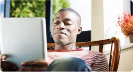 Man reading a tablet.