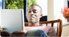 Man reading on a tablet.