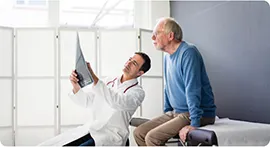 Doctor showing the treatment results to a patient.