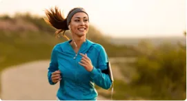 Woman jogging on a trail.