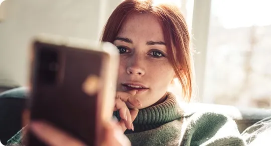 Woman checking her phone.