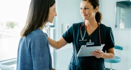 Nurse checking on a patient.