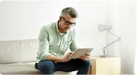 Man writing on his tablet.