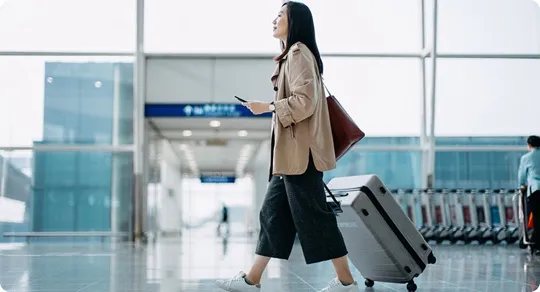 Passenger walking through the airport.