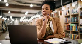 Woman studying at the library.