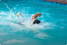 Swimmer swimming in a pool.